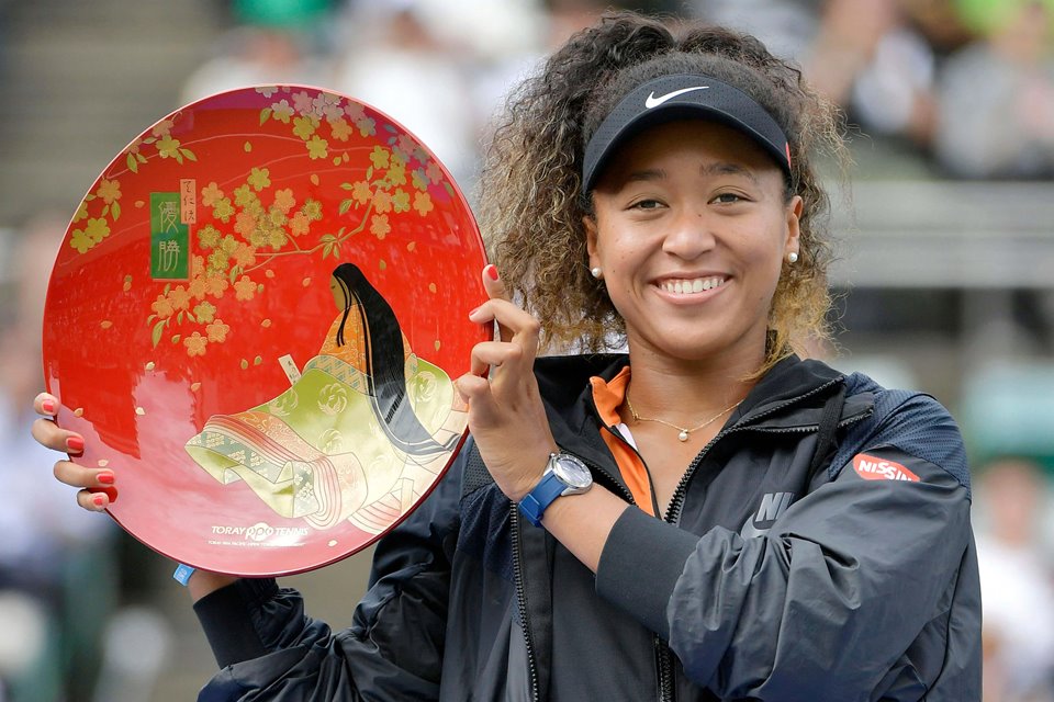 Naomi Osaka holds trophy after winning tournament in Japan