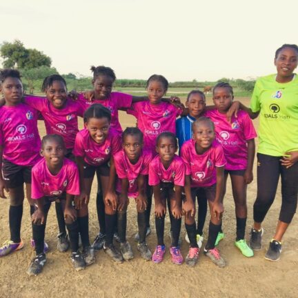Girls soccer team posing for photo