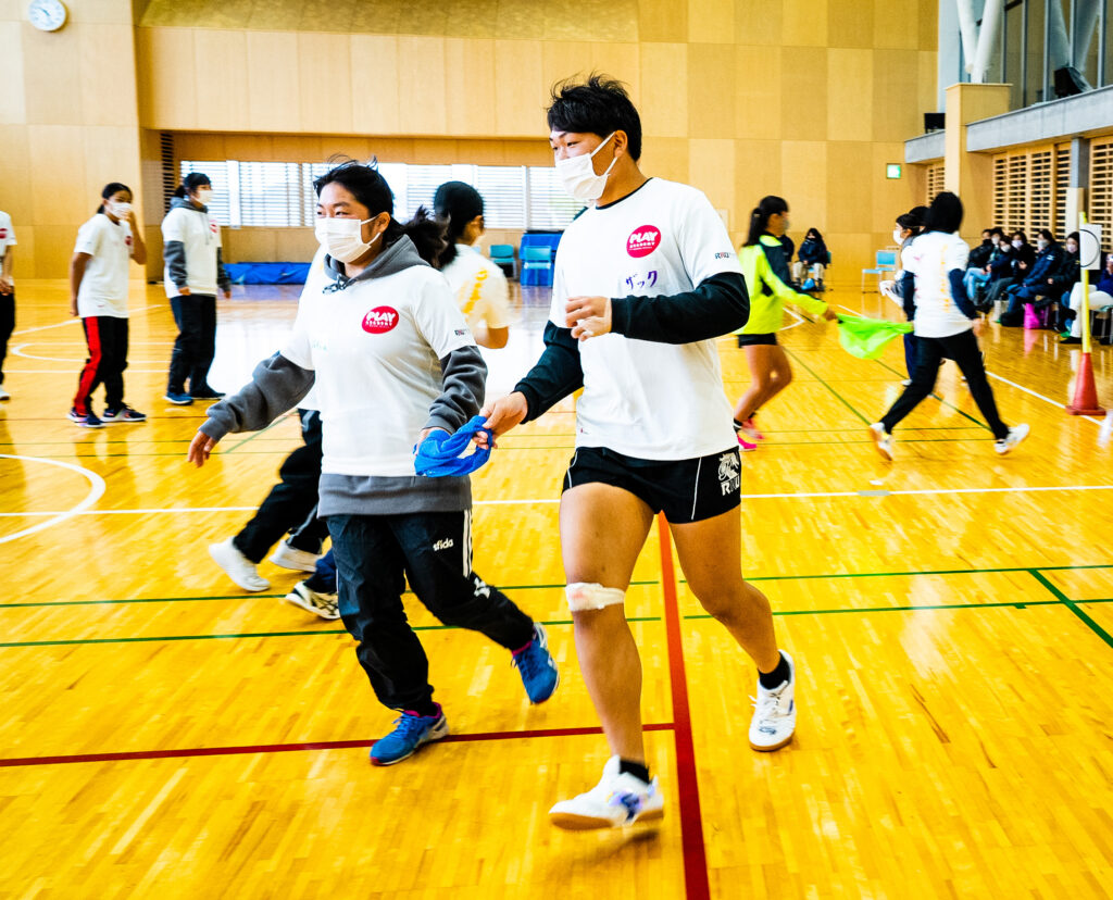 Pair of students running together