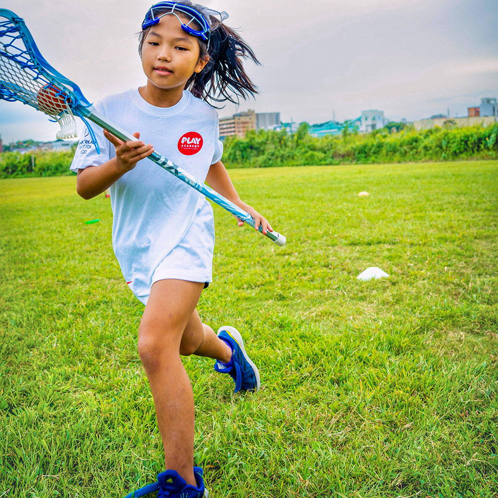 Japanese girl playing lacrosse