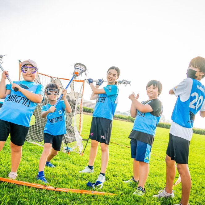 Group of young lacrosse players posing for a photo