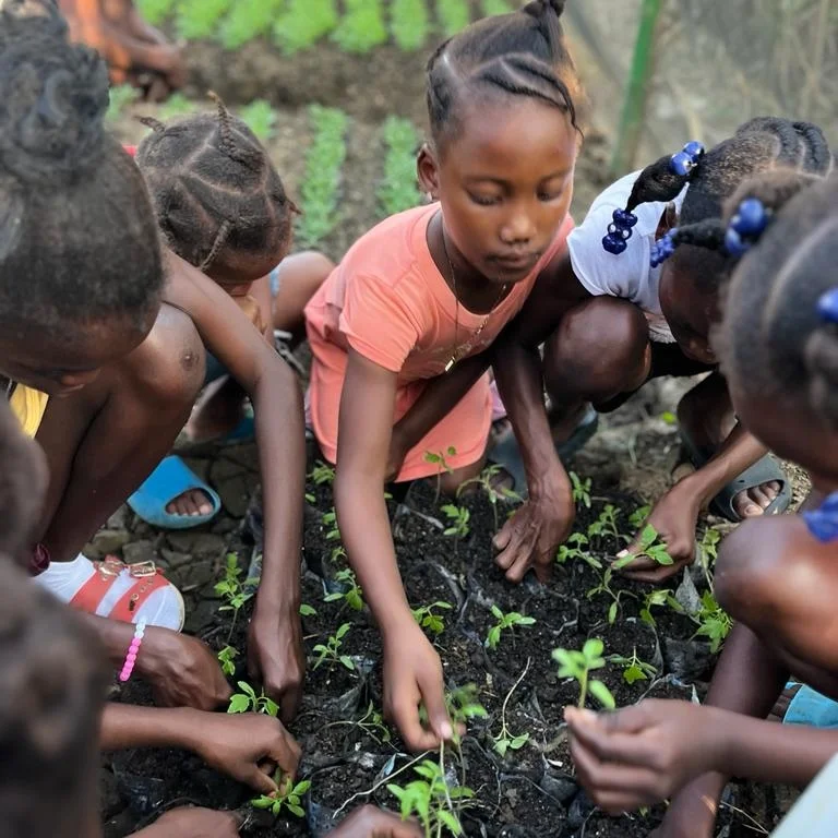 Kids planting seeds