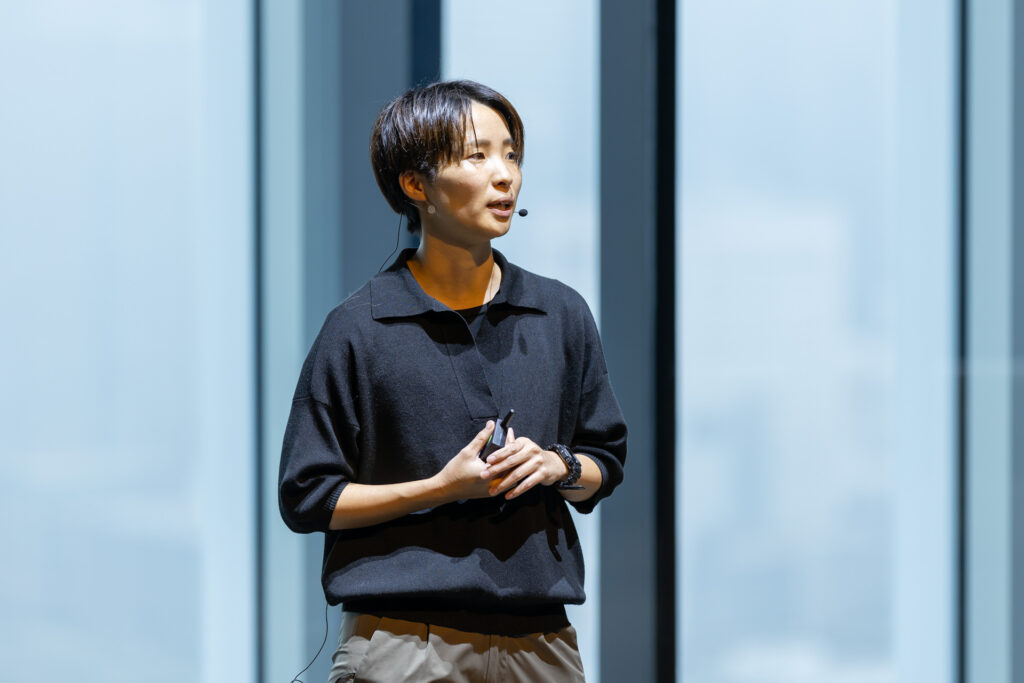 Woman on stage speaking