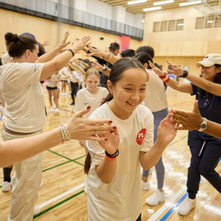 Coaches high-five girls