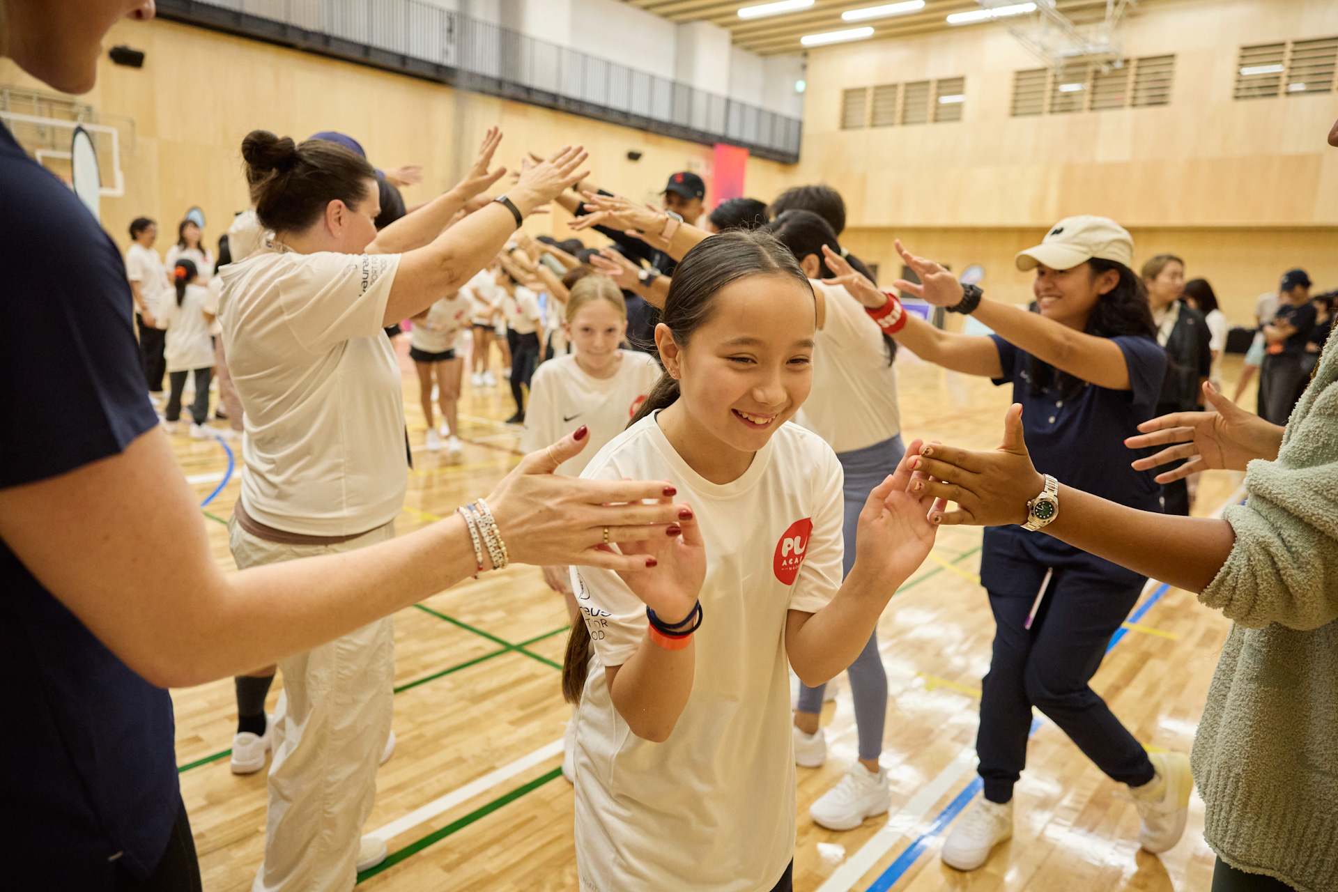 Coaches high-five girls