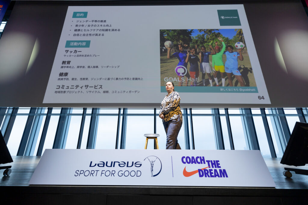 Woman giving presentation to audience