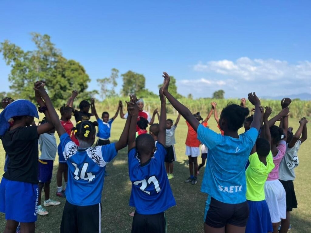 Group of kids form circle holding hands